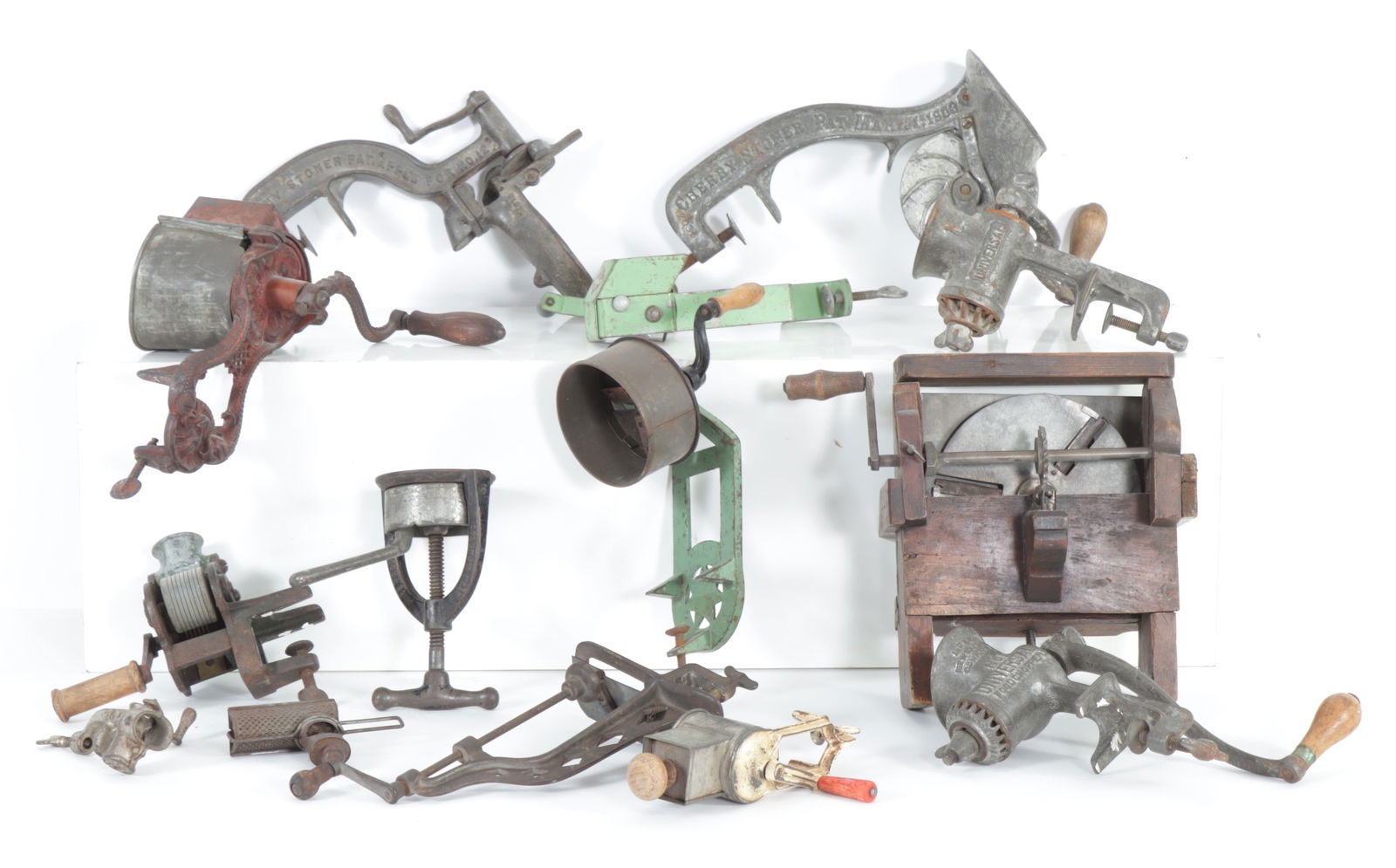 Twelve 19th-20th C. Meat Grinders & Food Choppers: Group of twelve 19th-20th C. meat choppers, food grinders, graters, soap shaver, items marked R.M. Co., Universal, Germany, L.F. & C., Triton, Griscer, unmarked, Silver & Co. hand held press, Sunny Mo