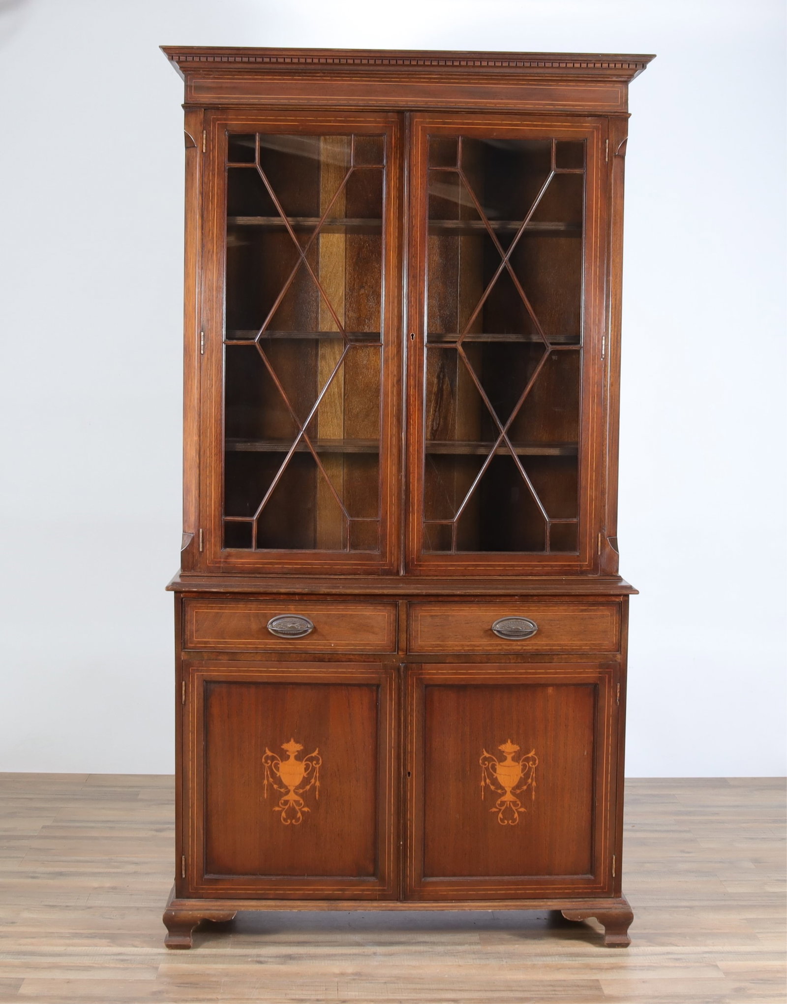 George III Style Inlaid Mahogany Cabinet: George III style inlaid mahogany cabinet, doors with urn and swag motif, bracket feet 84 H x 43 1/2 W x 17 1/2"D