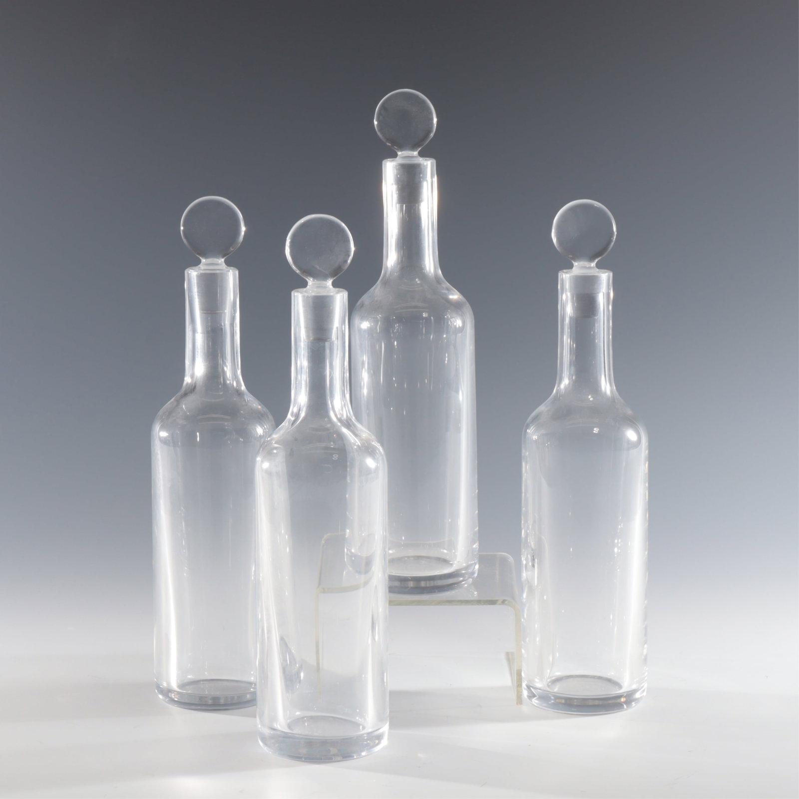 Baccarat Dionysos Cruet Bottles: Four bottles with stoppers. marked on bottom. 9.5" H to stopper 2.25" Dia Property from a renowned fashion executive, Washington, CT.