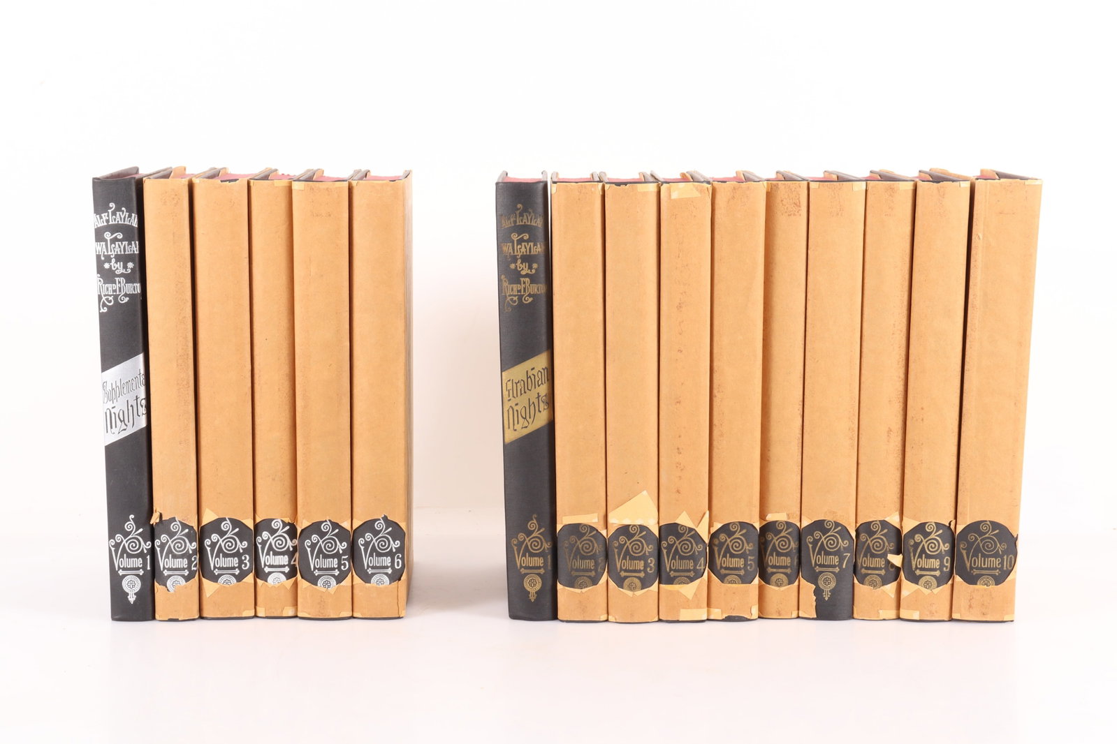 16 Volumes Arabian Nights and Supplements: 10 volume set of The Arabian Nights, Richard F. Burton, Burton publishing, 1940 and 6 volumes Supplemental to Arabian Nights.Both sets sporting home made paper covers. Both sets with gold/silver embos