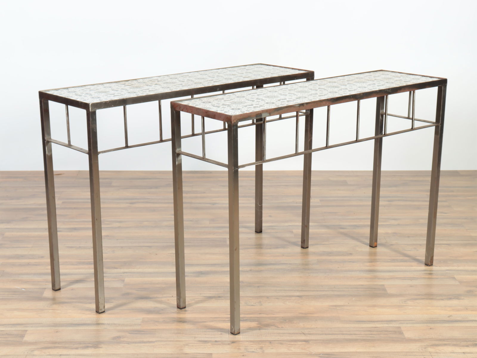 Pair Tile Top Conservatory Tables: Pair Tile Top Conservatory Tables, tiles early 20th C., iron bases modern 30.25" H x 43" W x 13" D Property from the estates of Thomas Johnson Hubbard and Anne Attfield Hubbard of Bronxville NY and Co