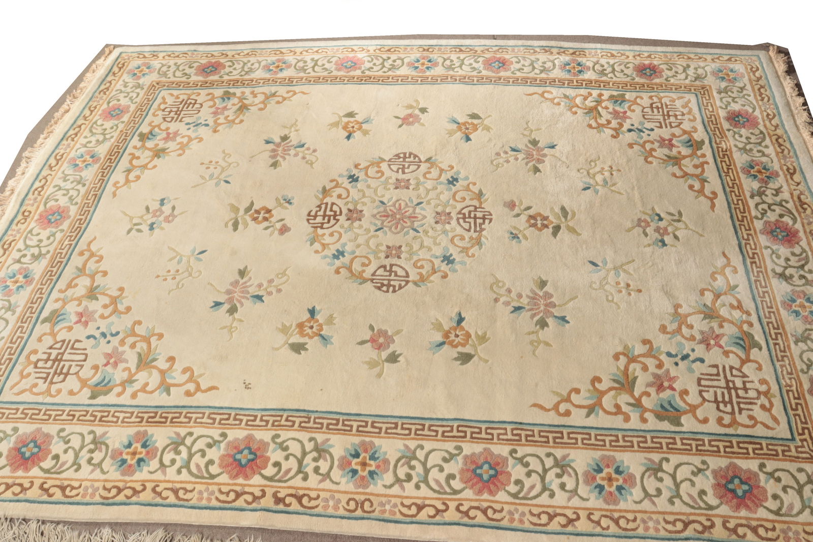 Chinese Wool Carpet 11-8 x 9: Chinese sculpted wool carpet, off white ground throughout, central round medallion with pale tan, blue, rose and green floral motifs 11' 8" x 9' Property from the estates of Thomas Johnson Hubbard and
