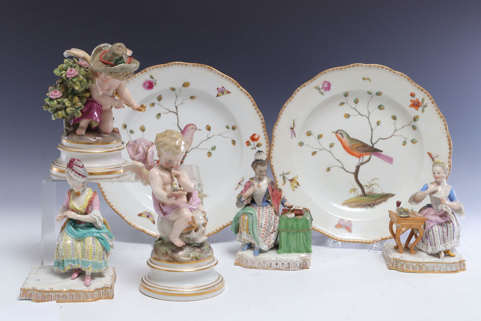 Group of Meissen Porcelain Figures & Plates: Group of Meissen Porcelain Figures & Plates. Comprising two cherubs, three sitting ladies, and two bird plates. Plates 9.5" diameter. Property from the estates of Thomas Johnson Hubbard and Anne Attfi