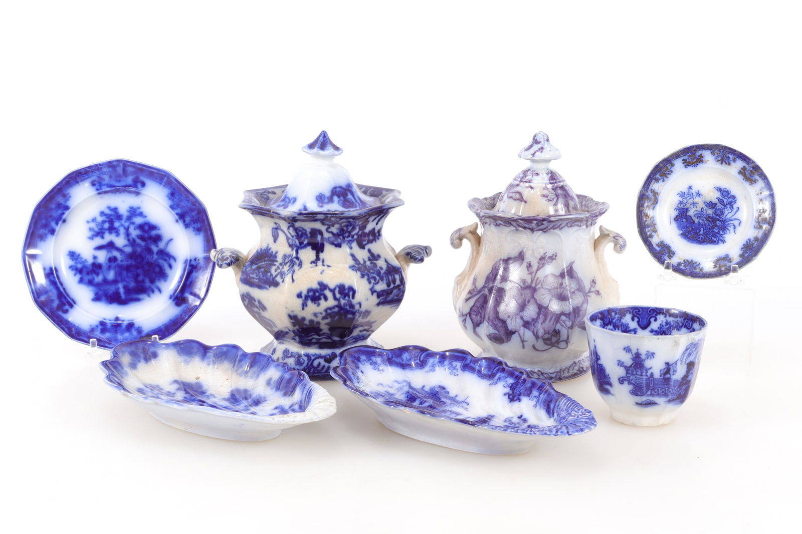 Group of Flow Blue Table Articles: Group of Flow Blue Table Articles: two covered bowls, four plates and a cup. Largest 7.75" H Property from the estates of Thomas Johnson Hubbard and Anne Attfield Hubbard of Bronxville NY and Cornwall