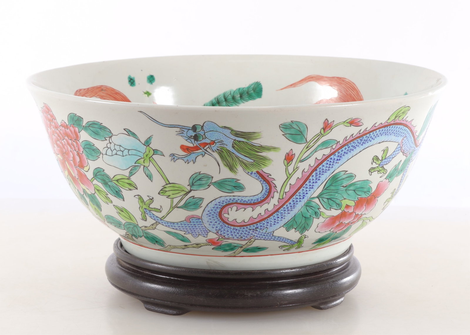 Chinese Famille Rose Dragon and Peony Bowl: Chinese porcelain famille rose Dragon and Peony bowl, koi fish interior, wooden stand 6 1/4 x 15 From a Stonington Connecticut Home