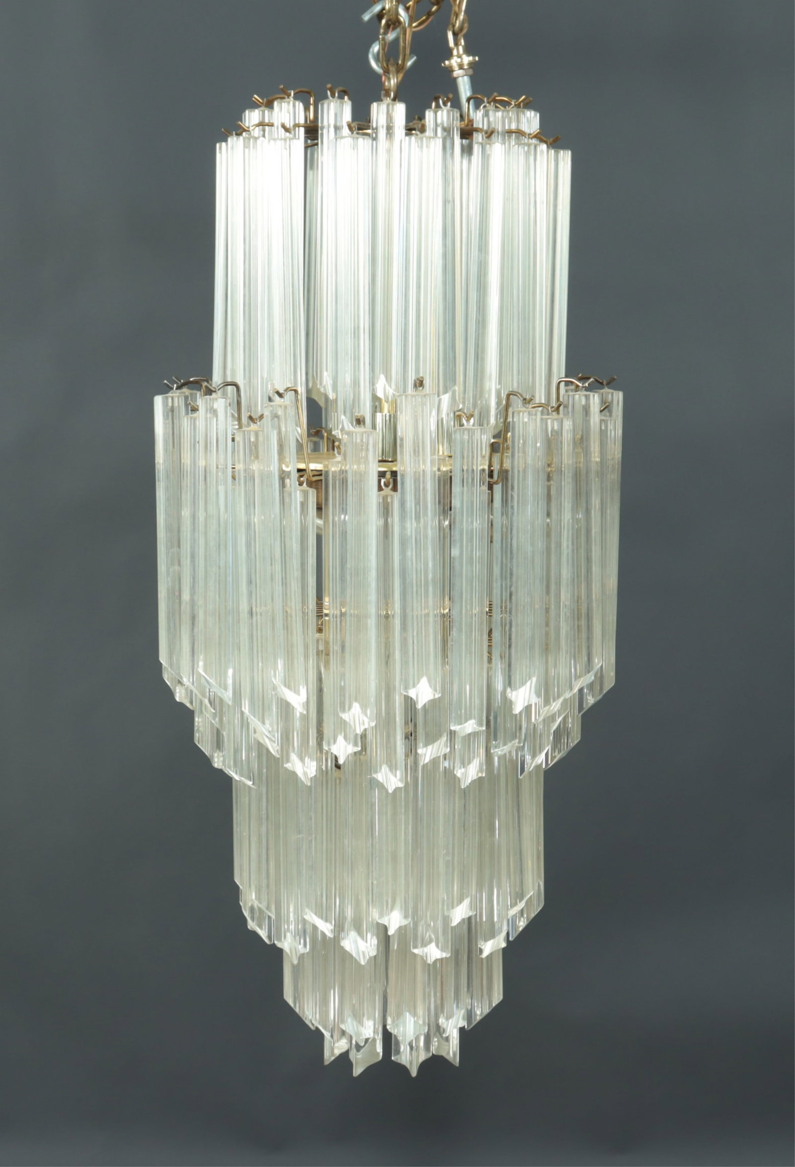 Paolo Venini Triedri Chandelier: Paolo Venini Brass Coated Metal & Glass Triedri Chandelier, 8 tiers 37" H x 17" Dia.
