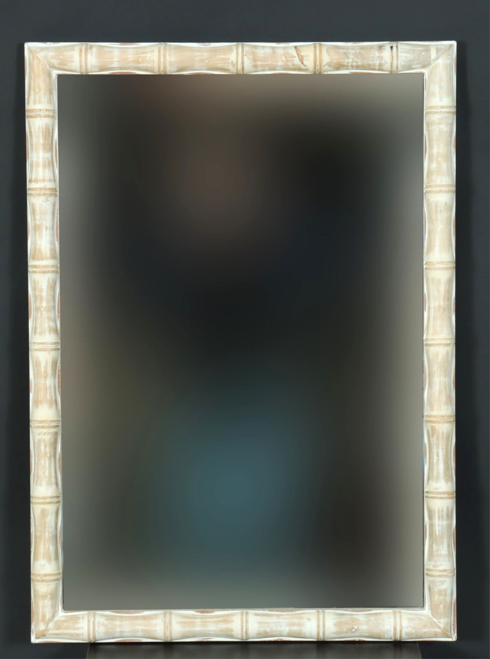 Pooky Baloo Faux Bamboo Mirror: Pooky Baloo Faux Bamboo Mirror, made in India, 21st Century, with beveled plate, antiqued painted finish. 28" H x 20" W Property from a North Canaan, Connecticut home.