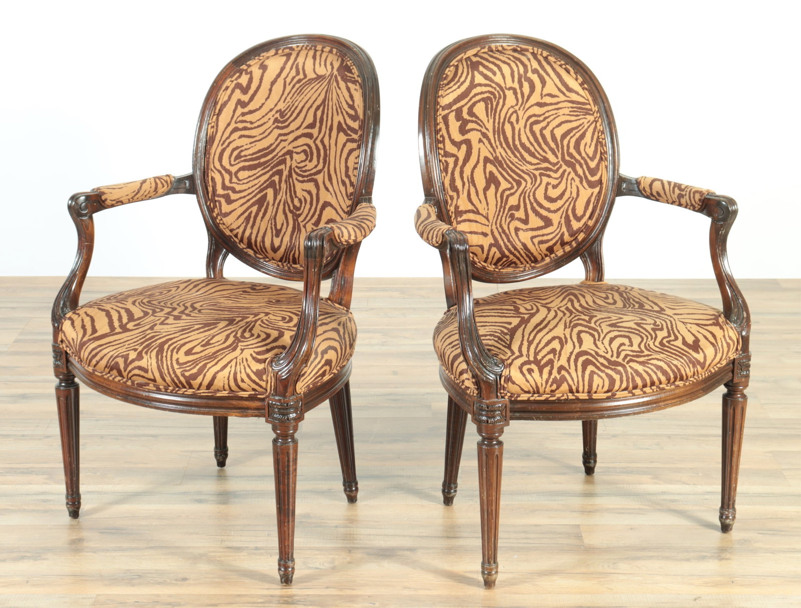 Pair of Louis XVI Style Fauteuils: Pair of Louis XVI Style Beech Fauteuils, upholstered in tiger stripe printed cotton 37" H x 23.5" W x 26" D Property from a Litchfield Connecticut home.