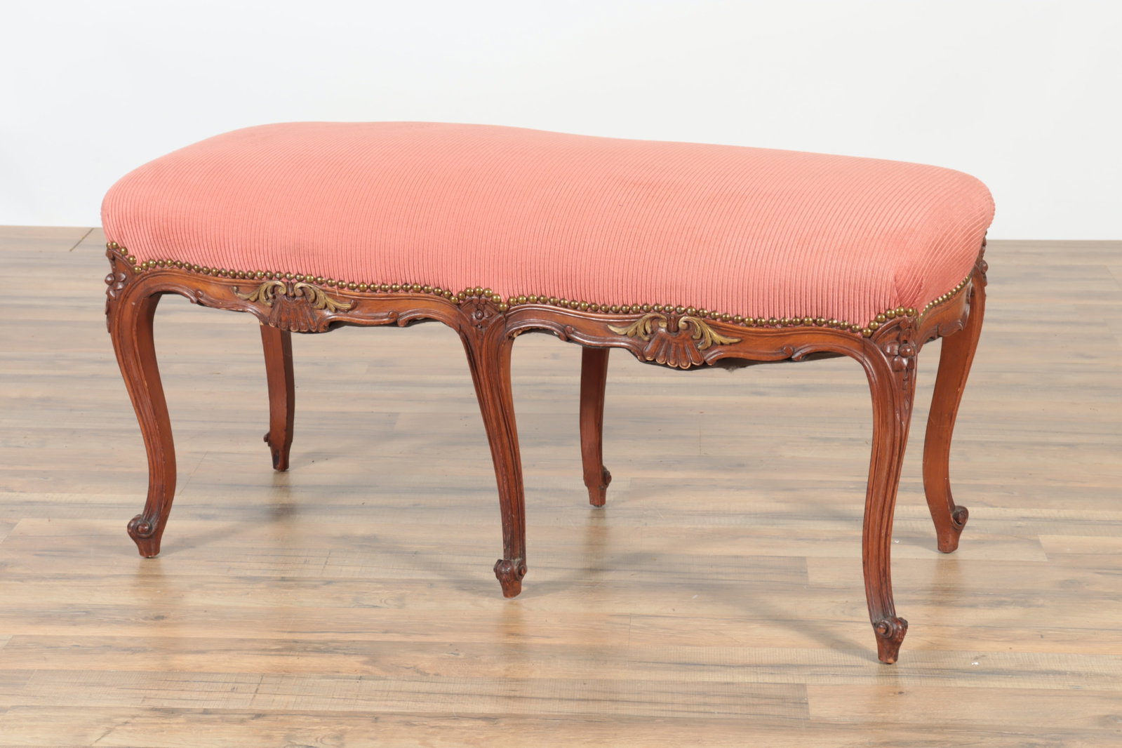 Louis XV Style Beech Banquette: Louis XV Style Beech Banquette, upholstered in dusty rose ribbed fabric. 20" H x 40" W x 18" D Property from a private Manhattan collection.