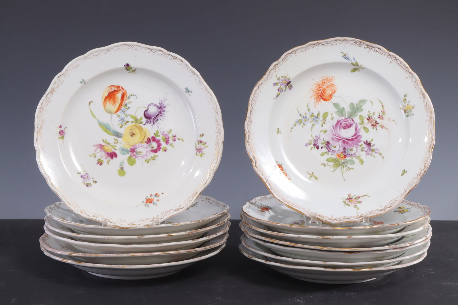 13 Meissen Porcelain Luncheon Plates: 13 Meissen parcel gilt porcelain luncheon plates, late 19th/early 20th Century, with floral decoration, gilt border and blue underglaze crossed-sword mark, impressed 3 / 17. 8 1/4" dia Property from a