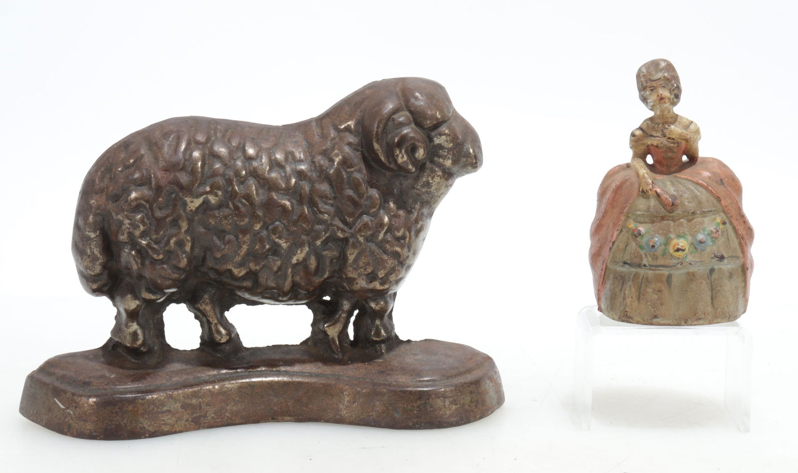 Late 19C/E20C Ram and Gowned Lady Doorstops: Gilt finish cast iron ram doorstop, shaped base. Painted cast metal ball-gowned/period dressed lady doorstop or as finial or gateweight. Substantial weight to each. Ram 6.25" H x 9" W x 2"Lady" 4.5" H