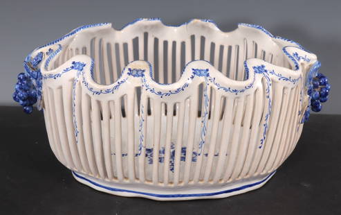 Faience Lattice Basket Bowl: Retailed by Bonwit Teller - Blue and White French Faience by Emile Tessier. Lattice Basket Bowl. Marked on bottom. 10.5" W x 7.5" D x 5.5" H Property from a New York Estate.