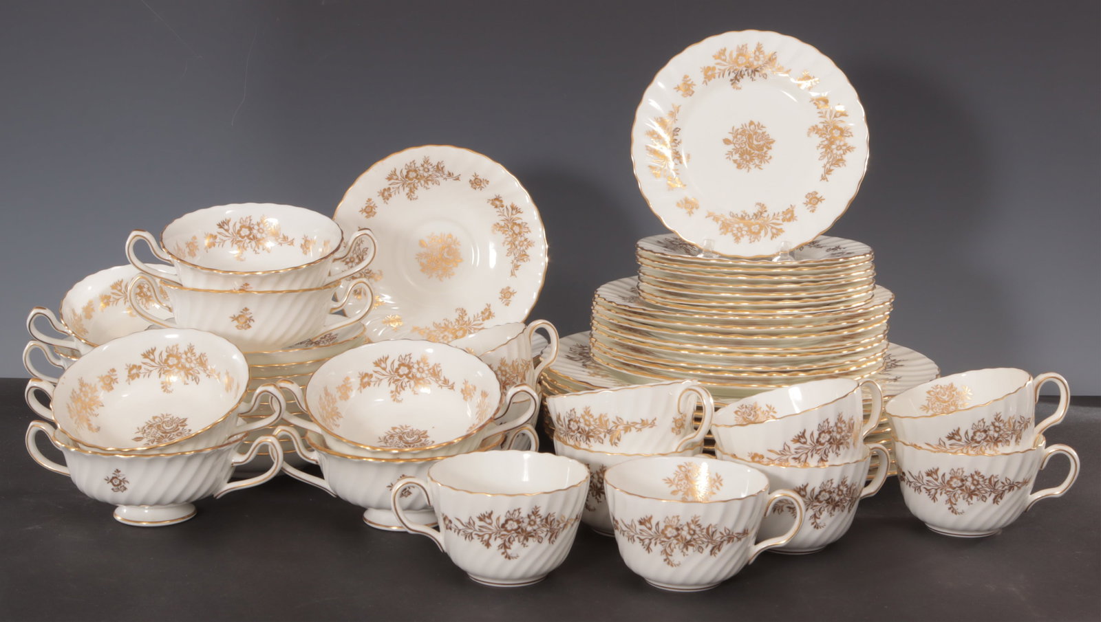 Minton Dinner Service: Minton Marlow Gold H-5017 Gilt Dinner Service. Dinner Plates (8) Salad Plates (8) Bread Plates (8) Two Handled Soup Bowl (8) Soup Under Plates (10) Tea Cups (8) Tea Saucier (10) Dinner Plates - 10.5"