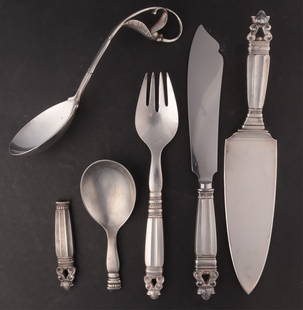 Georg Jensen - Gilbert Rhode Sterling Flatware: Group of 4 Georg Jensen sterling silver serving flatware pieces comprised of Peapod serving spoon #141, Spoon c.1970 Spoon, weight 4 ozt., along with Gilbert Rhode for Georg Jensen Acorn (Konge) Servi
