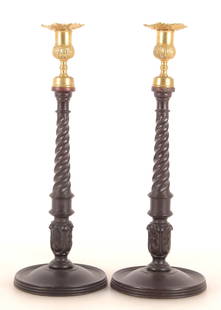 Pair Mahogany & Brass Candlesticks: Pair mahogany and brass candlesticks, probably 18th Century, with cast brass bobeche, twist-carved standards, acanthus and turned bases. Unmarked. 14 5/8" H; 5 1/4" dia