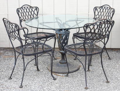 Black Painted Patio Dining Set: Black painted patio set, comprising a circular glass-topped table and four chairs Table: 28 1/2" H x 39" DiaChairs: 34" H x 24" W across arms