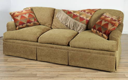 Contemporary Upholstered Sofa: Contemporary Upholstered Sofa, in green textured chenille with two throw pillows and blanket. 31" H x 84" W x 37" D Property from a Northwest Connecticut collection.