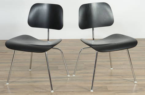 Pair Charles Eames for Herman Miller Chairs: Pair of Charles Eames for Herman Miller DCM Side Chairs molded black stained plywood and metal, marked under seat 29 3/4 x 19 3/4 x 20 From a Greenwich Connecticut Collector