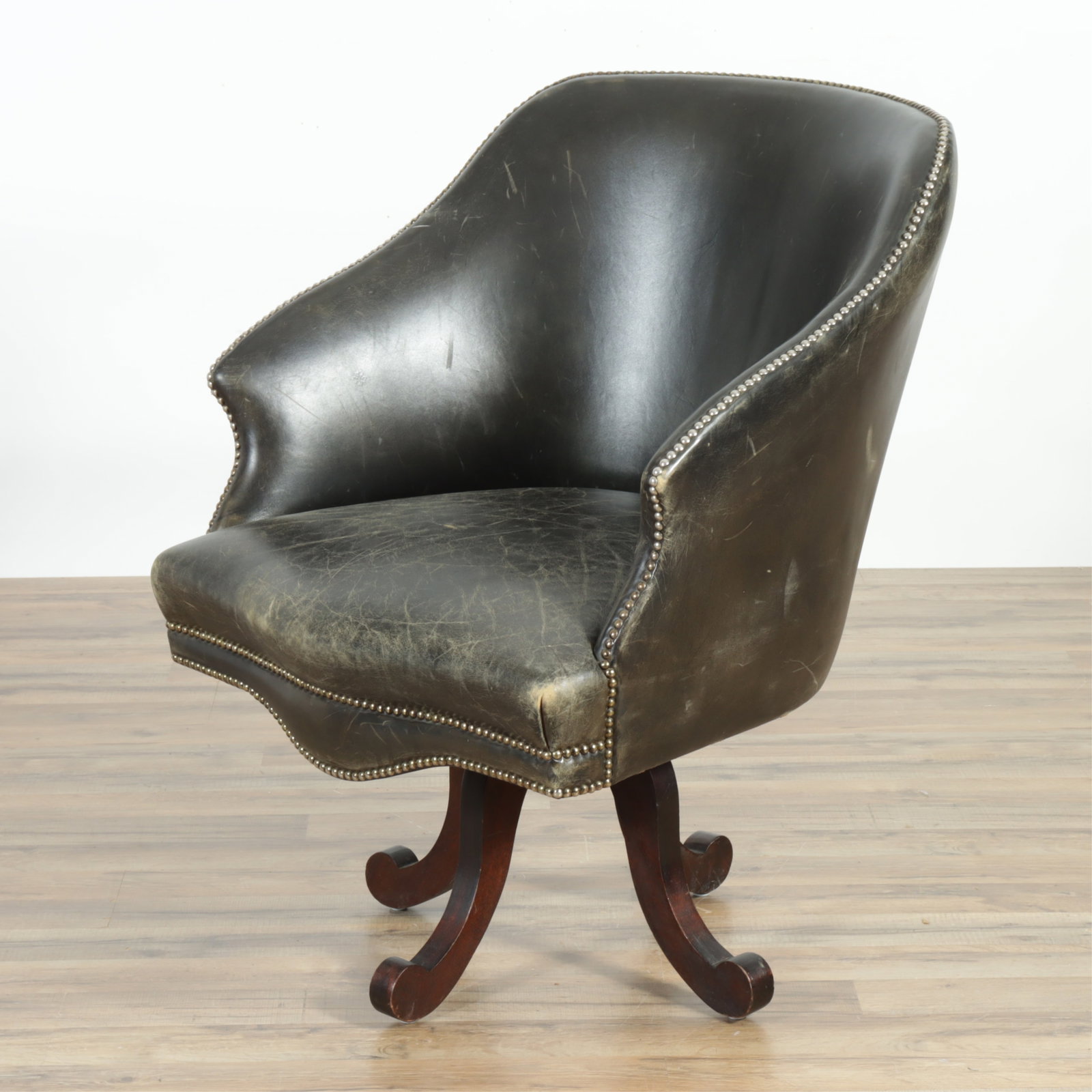 Victorian Style Leather Desk Chair: Victorian Style Leather Desk Chair. Black painted, upholstered in black tacked leather. 37" H x 29.5" W x 21" D Property from a Litchfield, CT collection