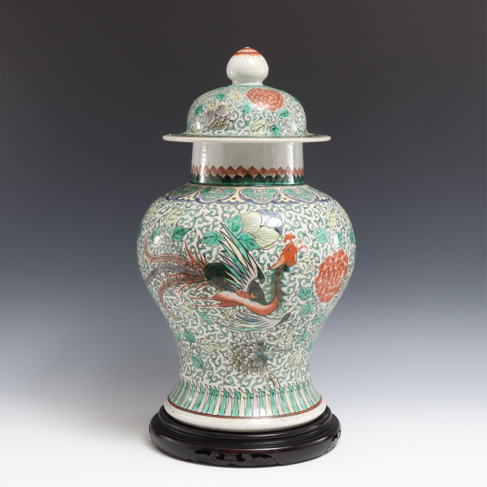 Chinese Export Famille Verte Porcelain Jar: Chinese Export Famille Verte Porcelain Jar with lid on ebonized hardwood base. Each side with long-tailed bird.18.5" H x 9" diam at widestProperty from a private Manhattan collection.