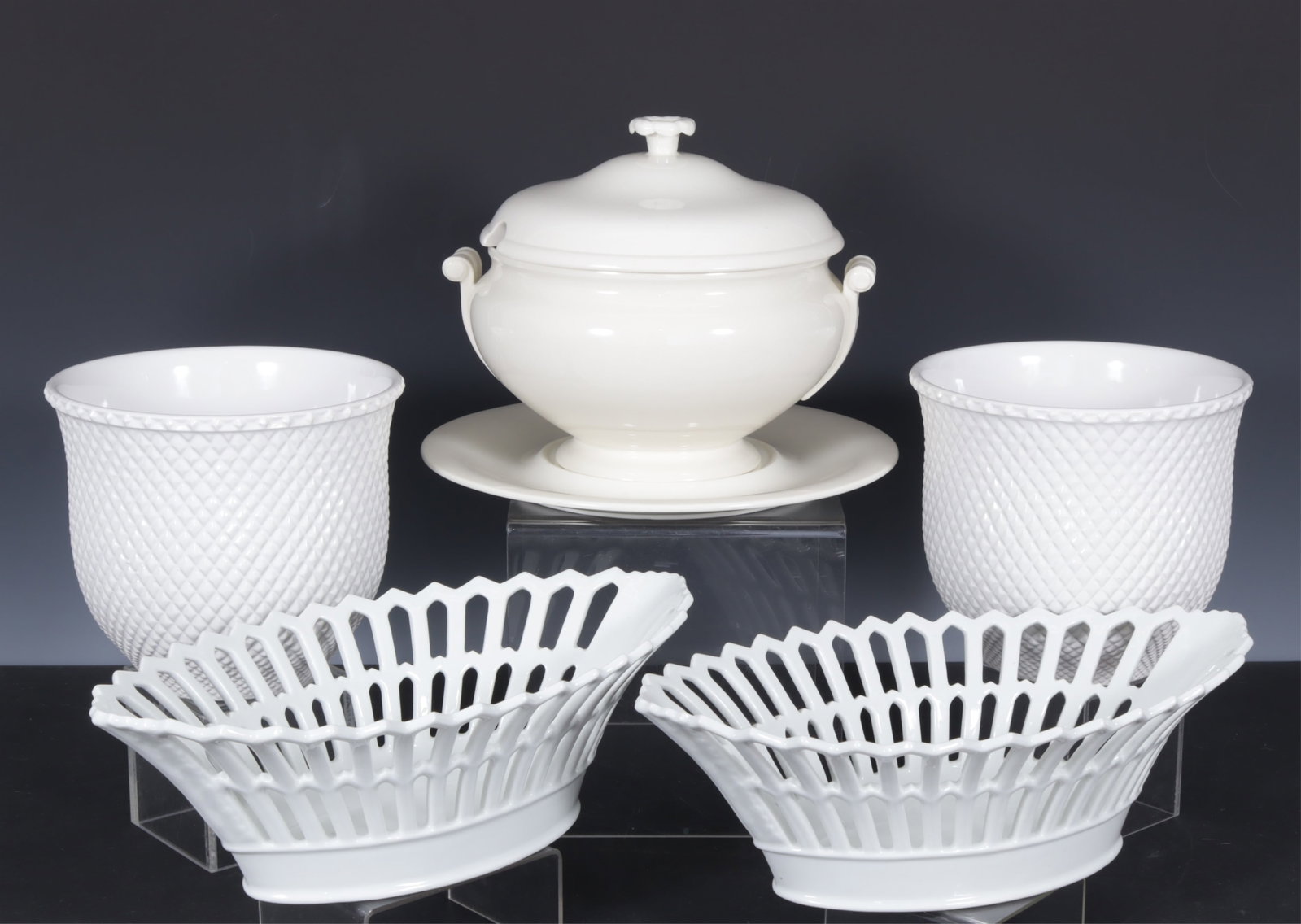 Group of White Porcelain Tableware: Group of White Porcelain Tableware. Comprising: Wedgwood covered tureen and underplate, pair of baskets, and pair of jardinieres. Tureen 9" H