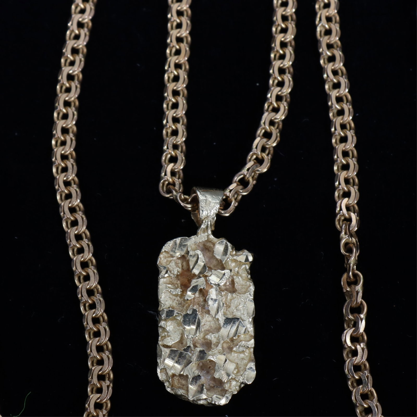 14K Yellow Gold Brutalist Pendant and Chain: 14k yellow gold brutalist style pendant, together with a 14k yellow gold Italian Prince of Wales style chain necklace. 15.7 grams. Pendant 1 1/8" long including bale. Chain 21" long Property from a no
