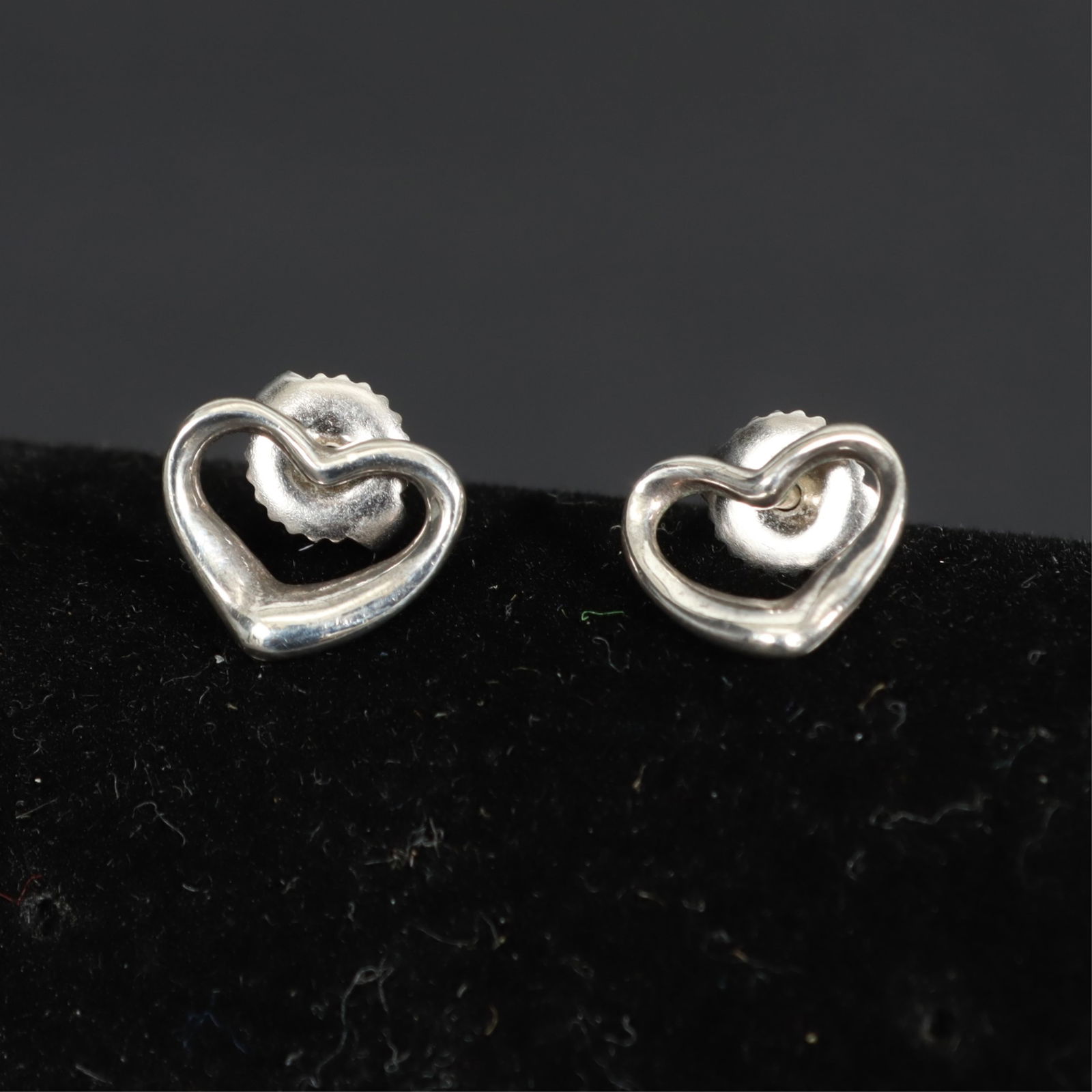 Pair of Tiffany & Co Elsa Peretti Heart Earrings: A vintage pair of Tiffany & Co, Elsa Peretti sterling silver open heart post earrings. 3/8" wide Property from the estate of Mary C. Bailey.