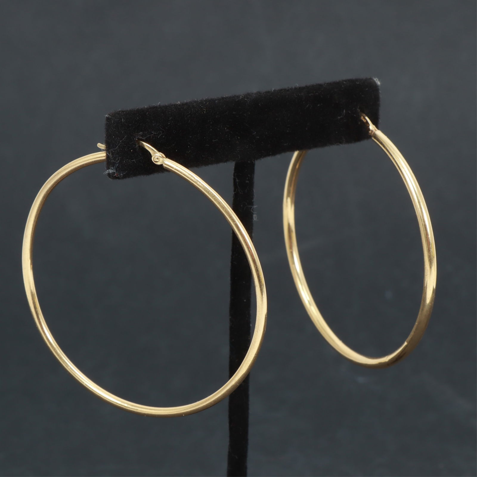 Pair of 14K Yellow Gold Hoop Earrings: Pair of hollow 14k yellow gold hoop earrings. Stamped 14K Italy on post. 3.4 grams. 2 1/8" diameter Property from the estate of Mary C. Bailey.