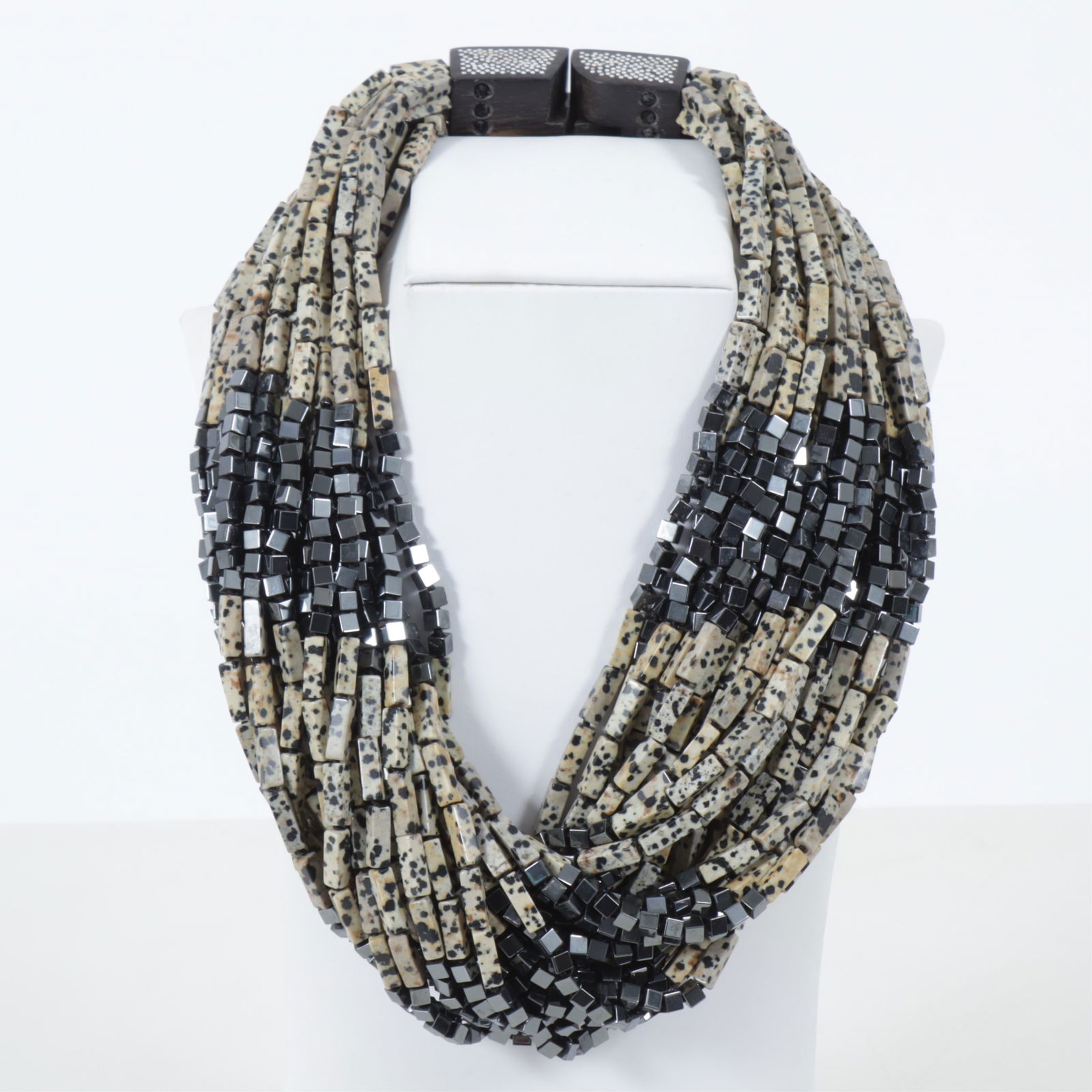 Patricia Von Musulin Multi-Strand Jasper Necklace: Patricia Von Musulin, 27-strand necklace comprised of 14 x 4mm rectangular Dalmatian Jasper hardstone beads segmented by square gunmetal steel beads. Signed on wooden clasp. 20.75" long Property from
