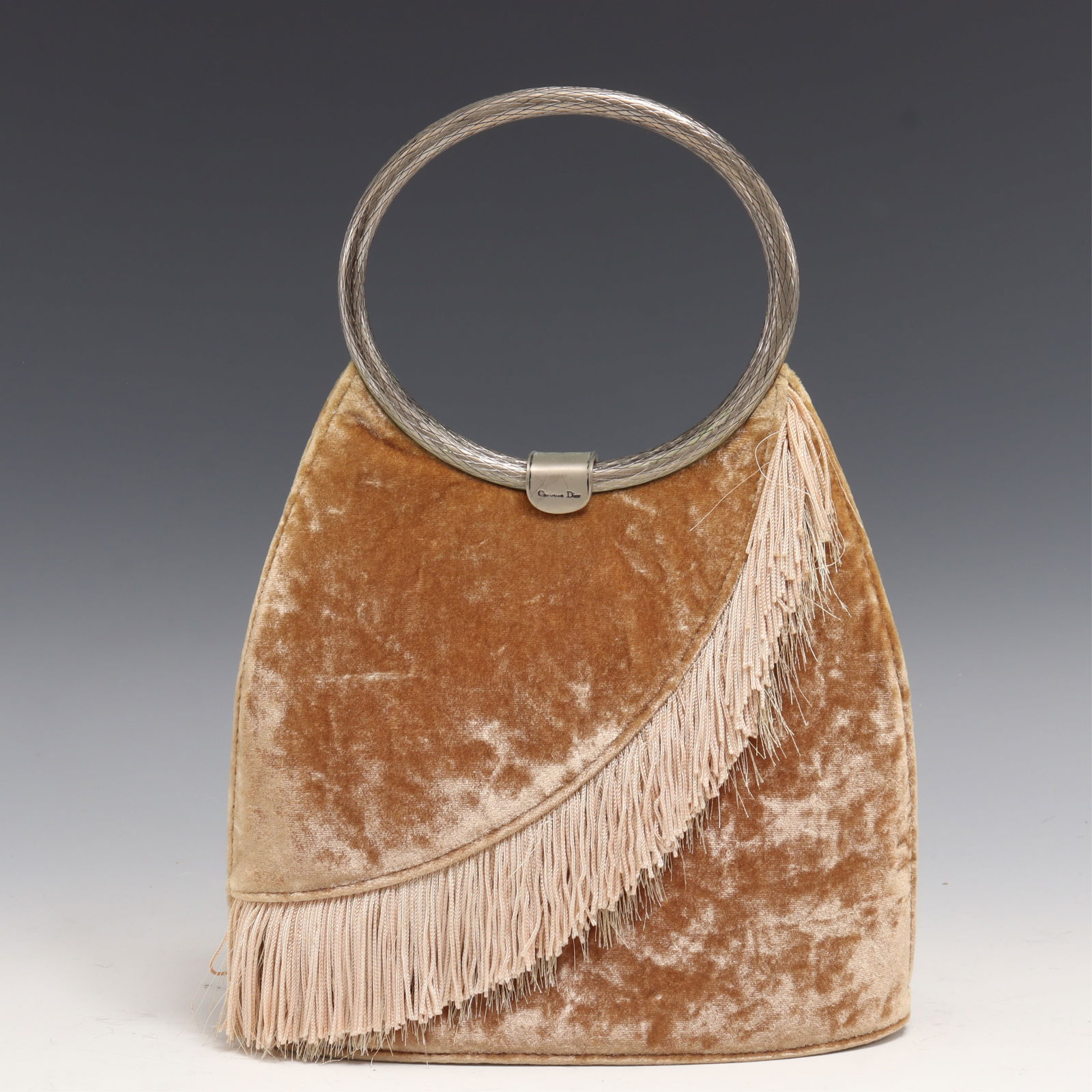 Vintage Christian Dior Suede Handbag: Vintage Christian Dior Suede Handbag. Tan suede and fringed exterior with metal loop handles, clasp closure, black fabric interior with one slip pocket. Made in Italy, MA-0958. 10.5" H x 7.5" W Proper