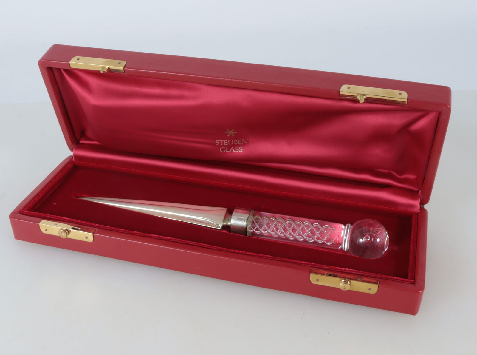 Steuben 'Air Twist' Letter Opener: A Steuben crystal letter opener with 'air twist' motif handle and sterling silver blade. Possibly designed by Frederick Carder for Steuben. 11" long Property from the estate of Mary Bundy.