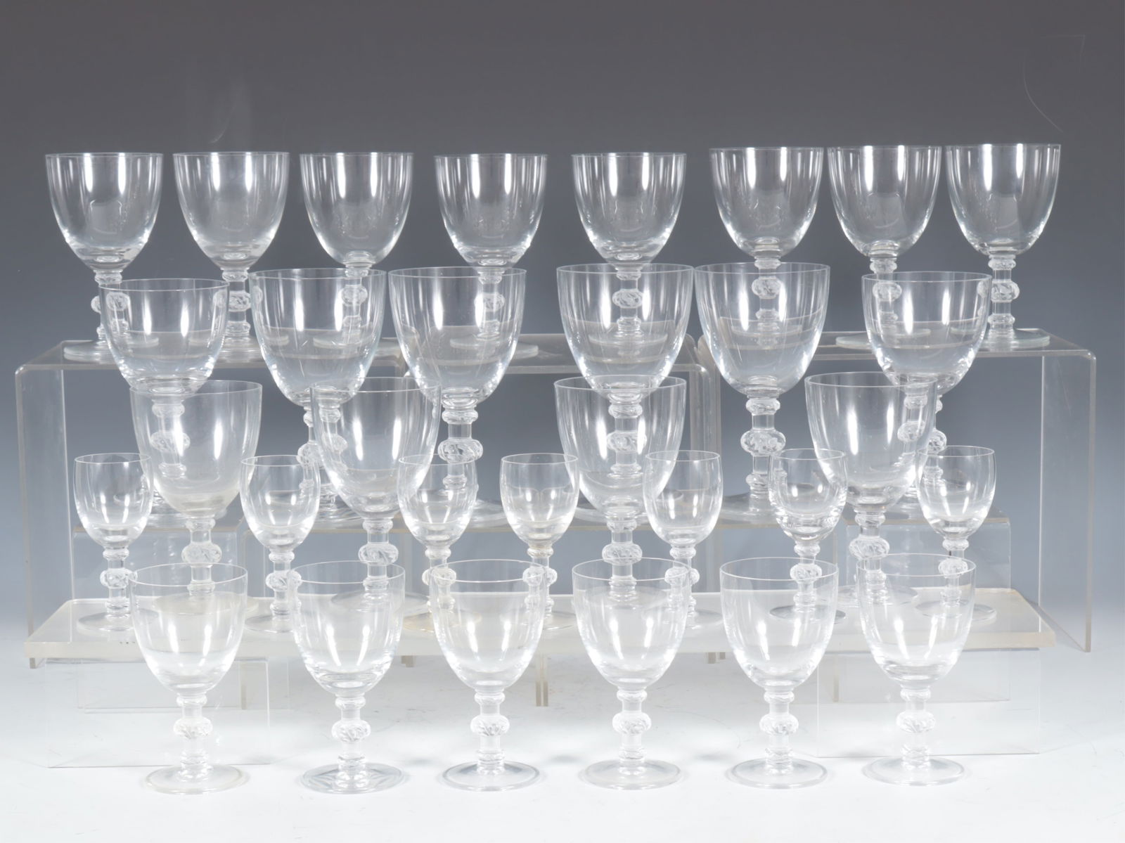 Lalique Saint Hubert Glass Stemware: Marc Lalique Saint Hubert 1947 glass stemware, includes 4 Water Goblets 6 1/4 x 3 1/2 (2 with chips to rim), 2 Bordeaux 5 3/4 x 3 1/4 (2 with chips to rim), 12 Red Wine 5 3/8 x 3 1/8, 6 White Wine 4 5