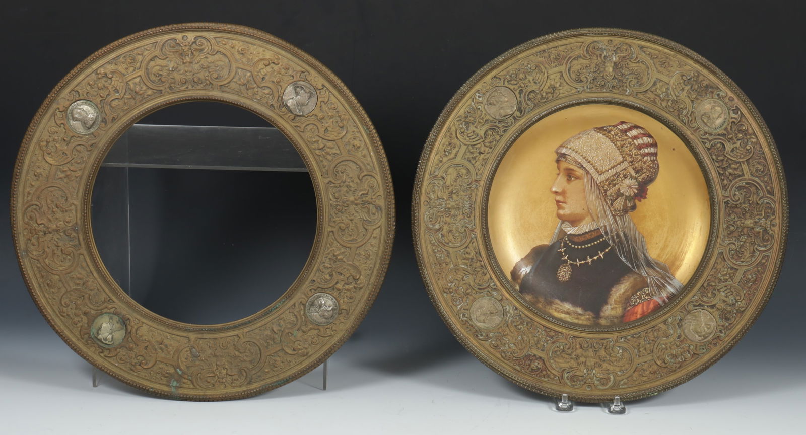 Pair of 19th C. Brass Tondo Frames: Pair of 19th C. Continental brass repousse tondo frames with inset coins one frame with Vienna style painted porcelain portrait after Wilhelm Menzler, German, 1846-1926, c.1880Dimensions: 16 1/2" diam