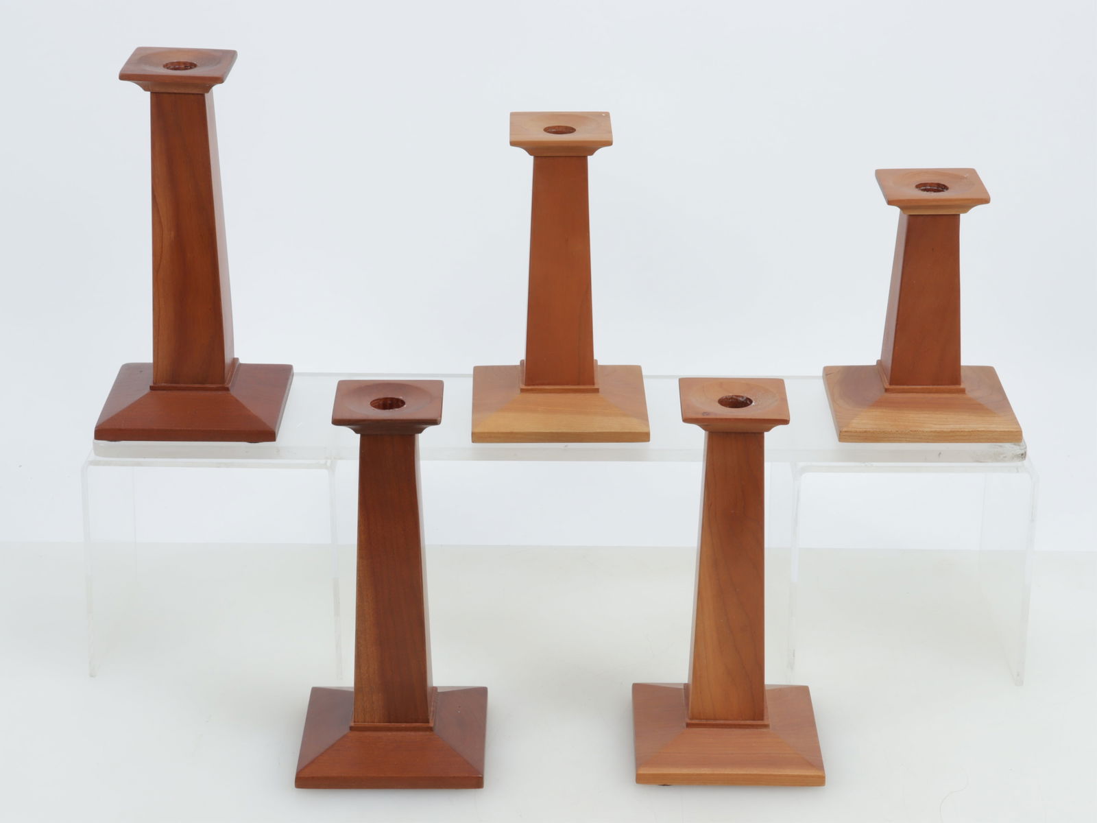 Five Stickley Cherry Candlesticks: Five Stickley Cherry Candlesticks, models 9113, 9111 & 9112, dated March 6, 2001.Dimensions: Largest 9" HProperty from the Estate of Mary C. Bailey