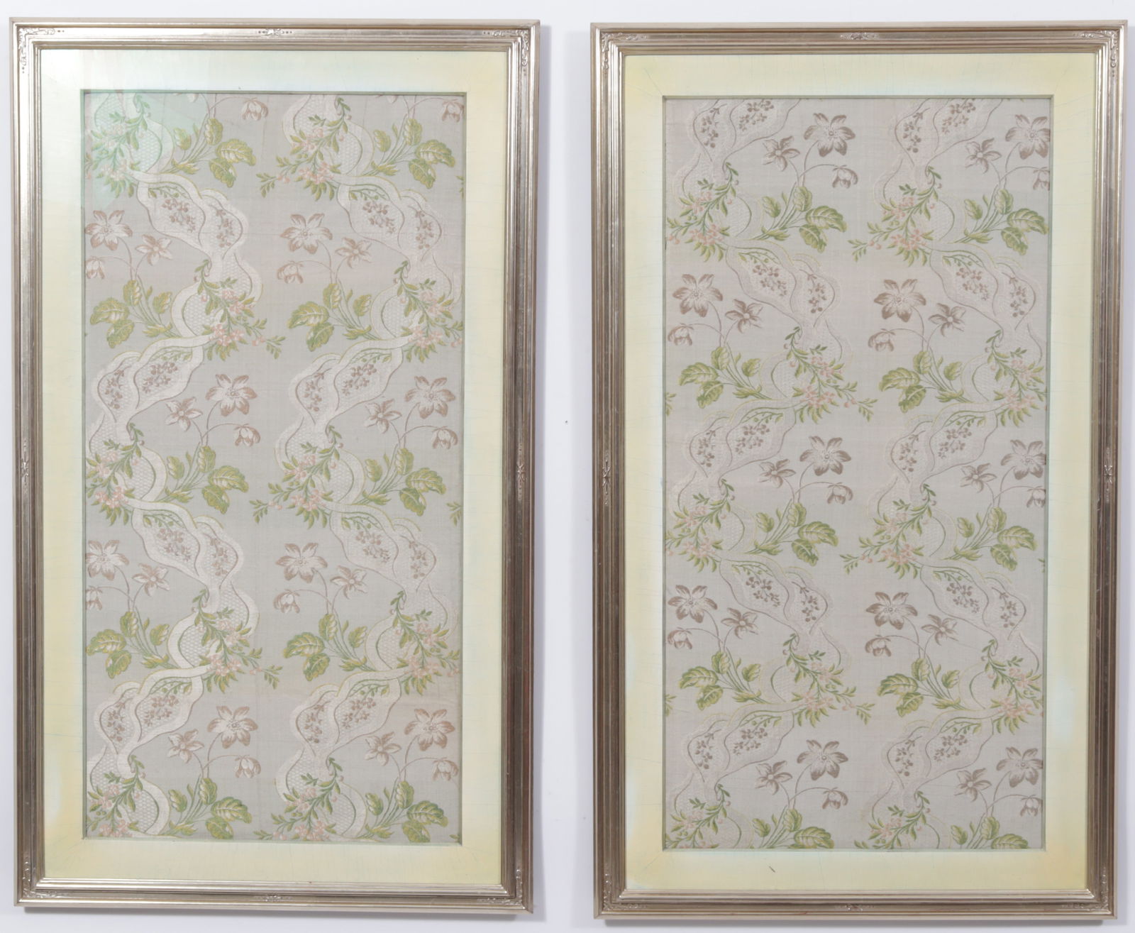 Pair of Silk Embroidered Panels: Meander Pattern Brocaded Lisere Silk. Paired, diaper-patterned serpentine ivory bands entwined with floral and foliate sprays in shades of plum, pale pink, salmon, green, and ivory on aquamarine canne