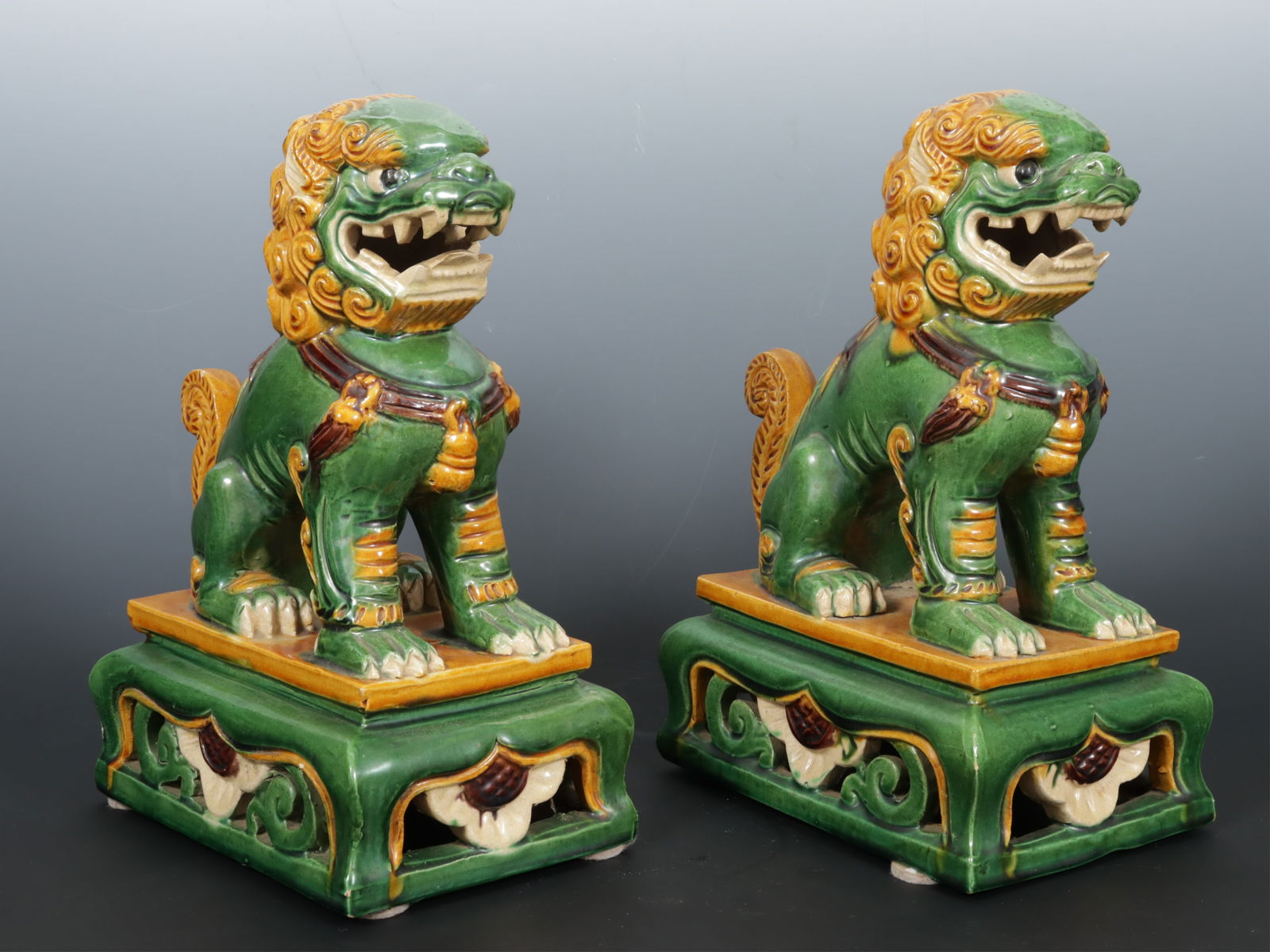 Pair Chinese Style Green & Ochre Glazed Fu Dogs: Pair Chinese Style Green & Ochre Glazed Fu DogsDimensions: 12" HProperty from a Bethlehem, CT collection.