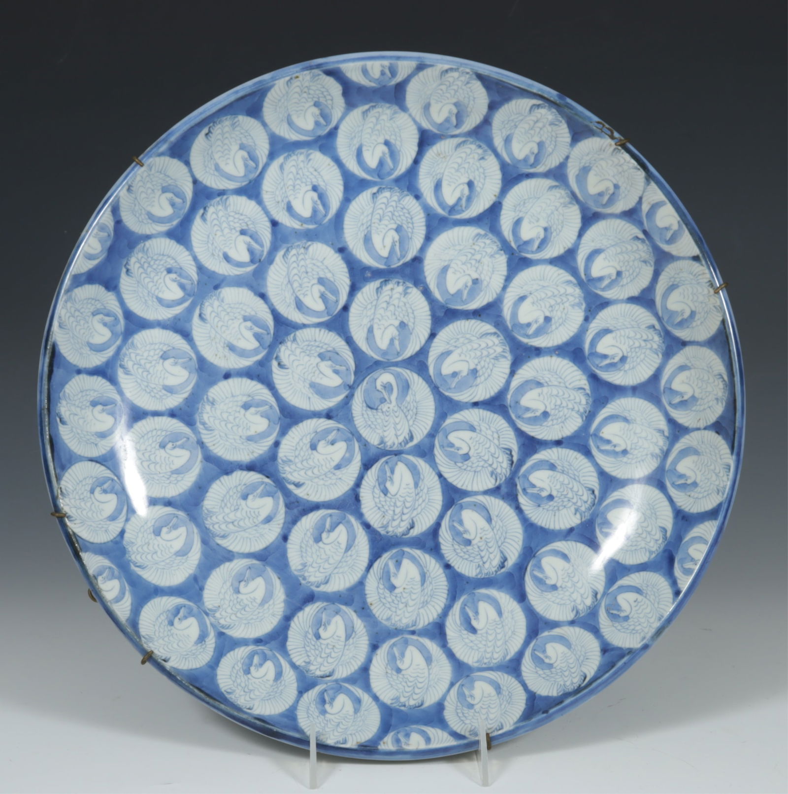 Late 19th C. Japanese Crane Porcelain Charger: Japanese, likely late 19th C. Crane porcelain charger, en verso apocryphal markings indicating Chinese Ming Dynasty, Chenghua year.Dimensions: 15 5/8 diameter x 2 3/4"HProperty from the L'Engle Camp