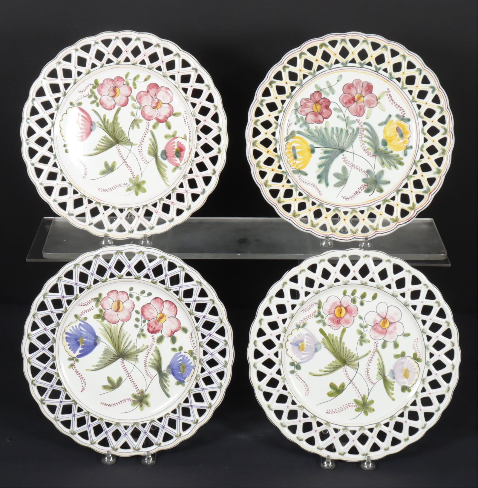 Four Nora Fenton Ceramic Reticulated Plates: Four Nora Fenton Ceramic Reticulated Plates, Made in Portugal. White ground with various floral decorations.Dimensions: 12" Dia.