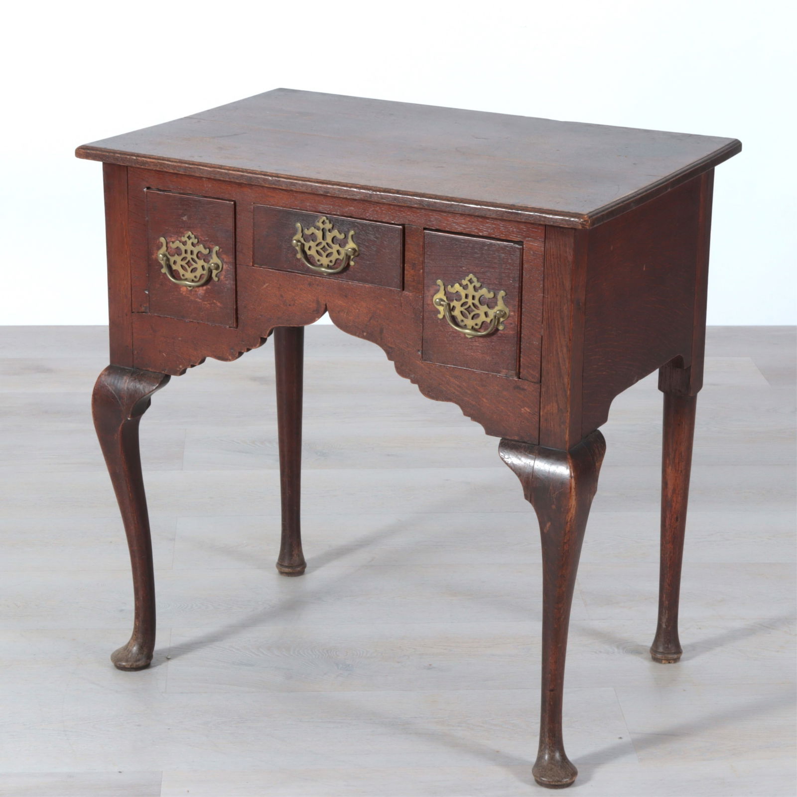 George III Oak Lowboy, 18th C.: George III Oak Lowboy, 18th C., with cabriole legs on pad feet.Dimensions: 29" H x 28.5" W x 19.25" D