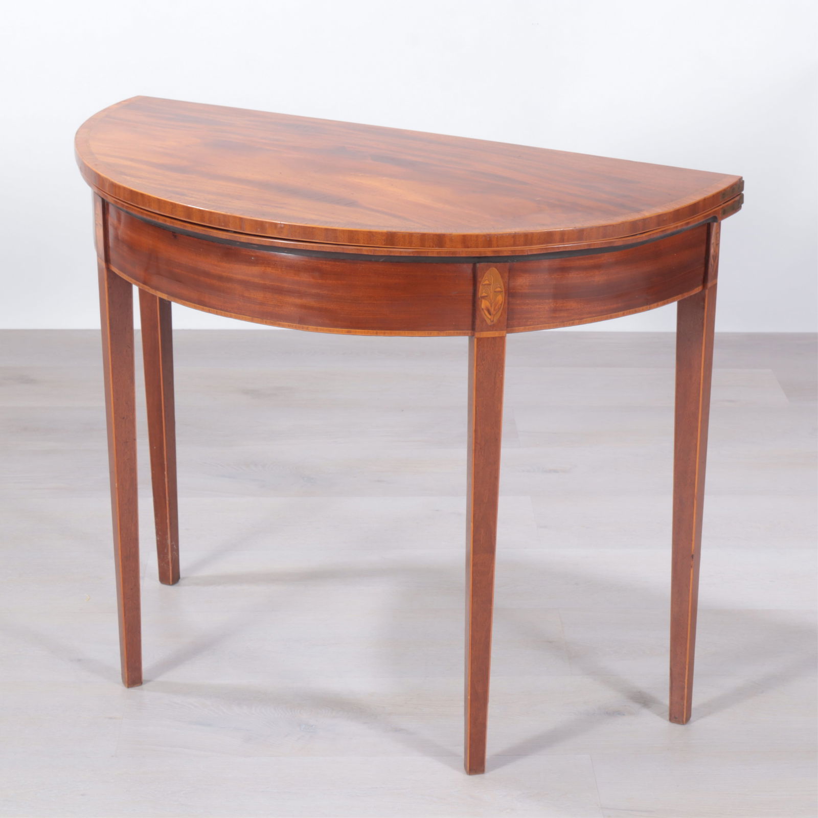 George III Inlaid Mahogany Demilune Games Table: George III Inlaid Mahogany Demilune Games Table, late 18th century or early 19th century.Dimensions: 28.5" H x 36" W x 17.75" D