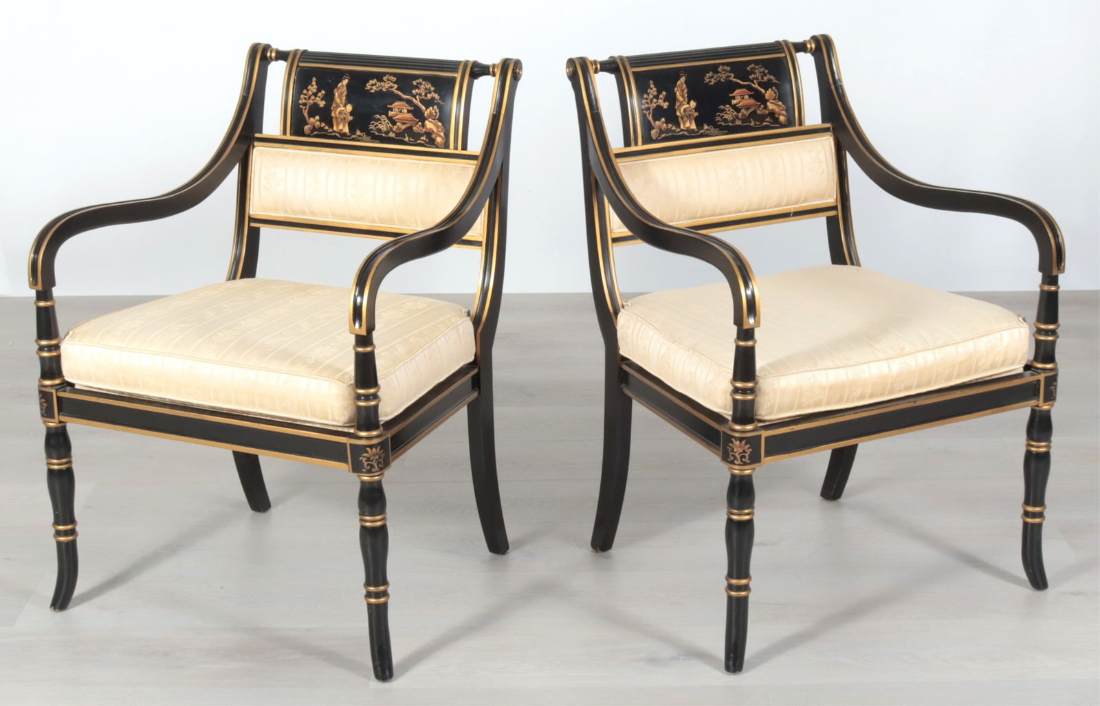 Pr Regency Style Parcel Gilt Black Lacquer Chairs: Pair Regency Style Parcel Gilt Black Lacquer Armchairs, by Drexel, in yellow foliate brocade upholsteryDimensions: 345" H x 24.5" W x 25" D