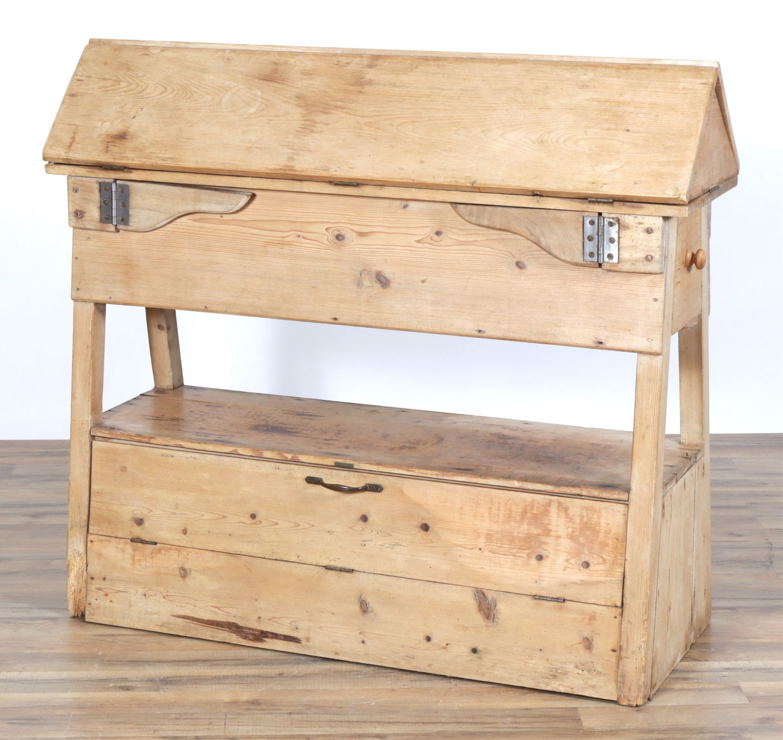 Knotty Pine Dropleaf Work Bench: Knotty Pine Dropleaf Work Bench, made up in the 20th Century of older elements. Hinged rectangular leaves form a peak when closed and open supported on hinged fly arms, each end fitted with a drawer,