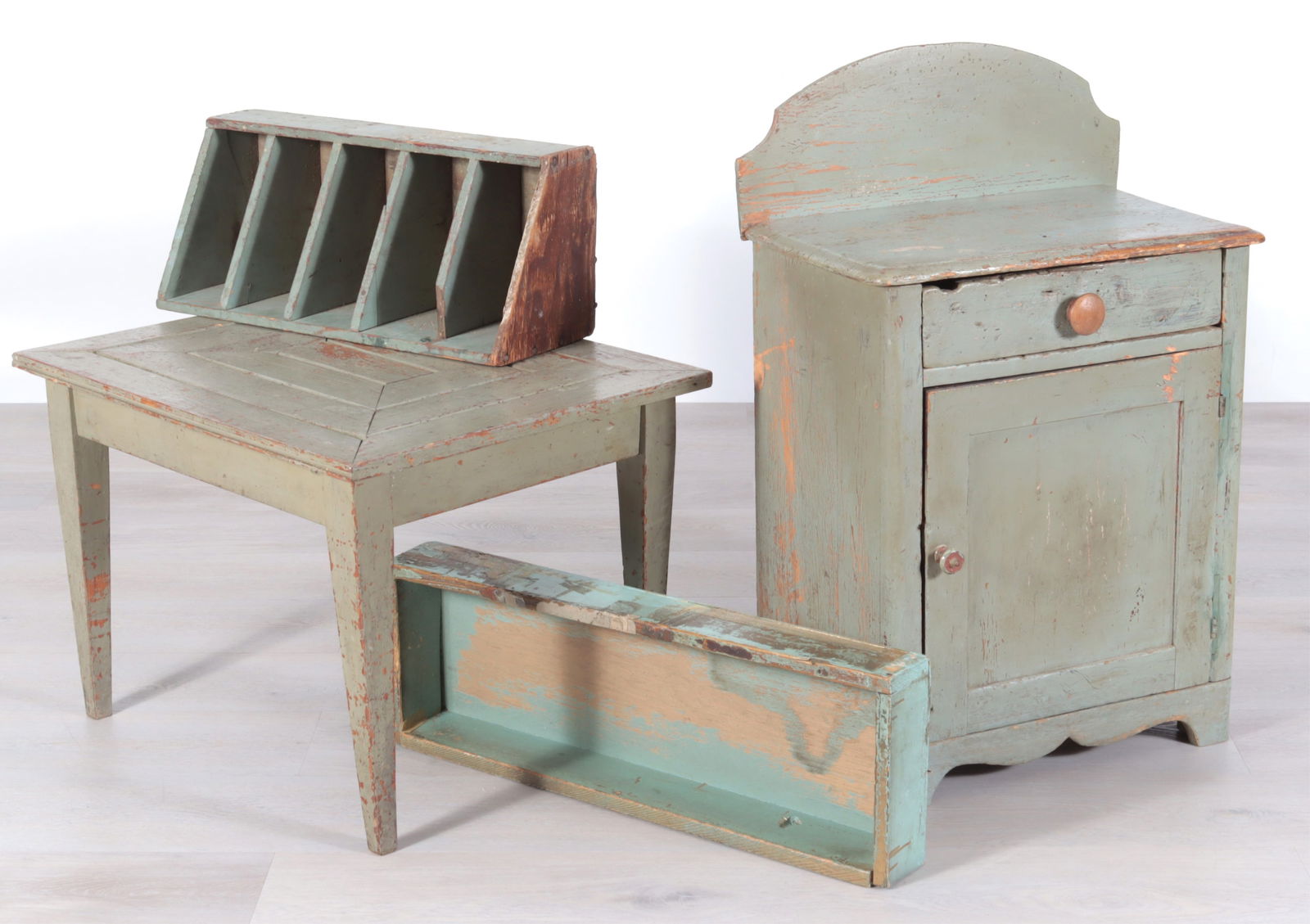 Group of Painted Furniture: Assembled group of four pieces of robins-egg blue furniture, 19th/20th Century, comprising:a four-tier corner wall shelf; a wood bin; a small cabinet and a low table.Dimensions: Wall shelf: 23 1/2" H