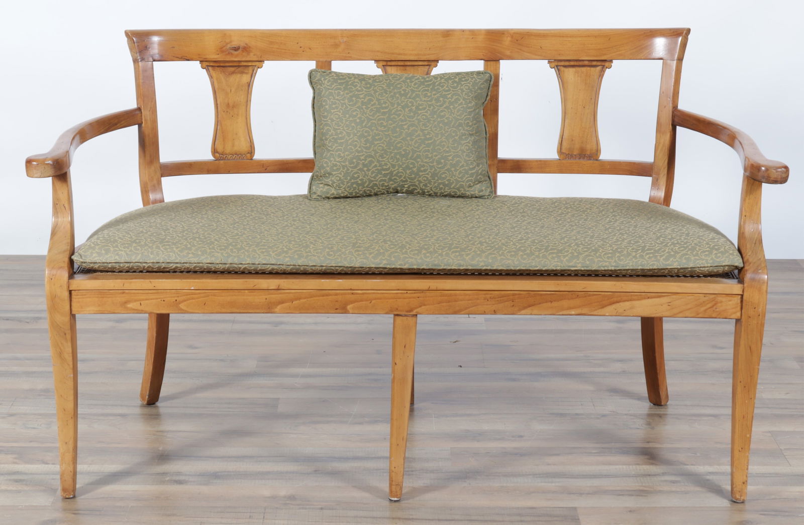 Regency Style Caned Bench: Regency style caned bench, with rounded back, caned seat, green and gold upholstered seat cushion and throw pillow.Dimensions: 33 1/4" H x 56'" W x 20 1/4" D