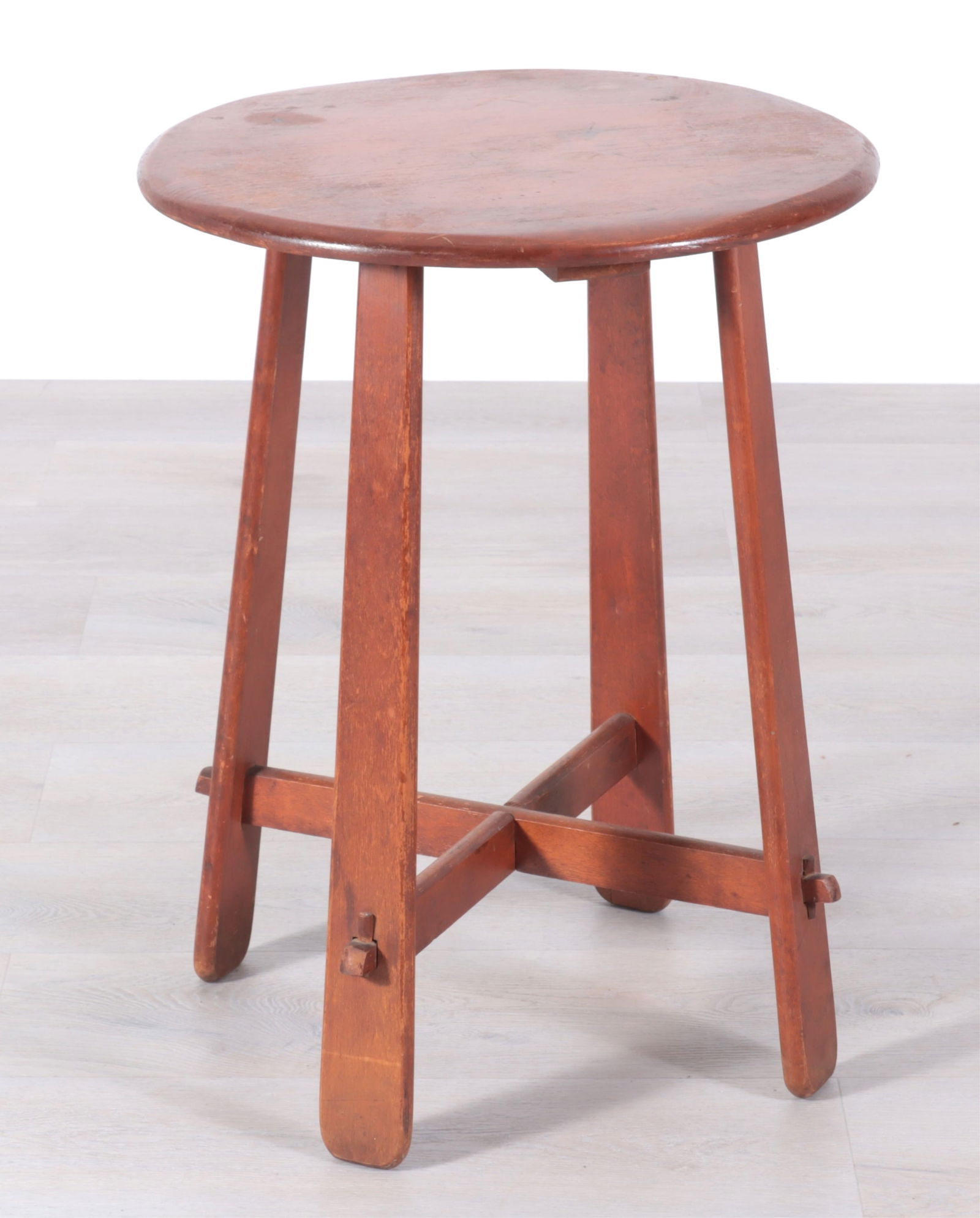Mission Style Circular Small Table: Mission style circular table, 20th Century, with four legs and an X-stretcher.Dimensions: 26" H x 20" Dia