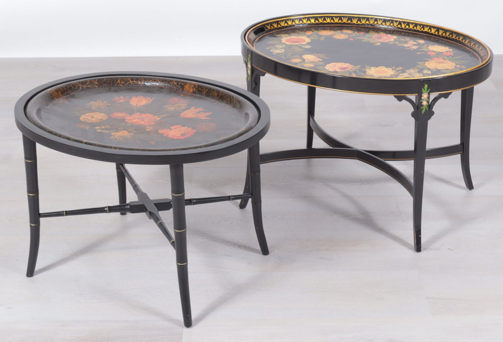 Two Victorian Polychrome Tole Trays: Two Victorian Polychrome Tole Trays, on later stands. Decorated with flowers.Dimensions: Larger: 19.5" H x 28.5" W x 21.5"