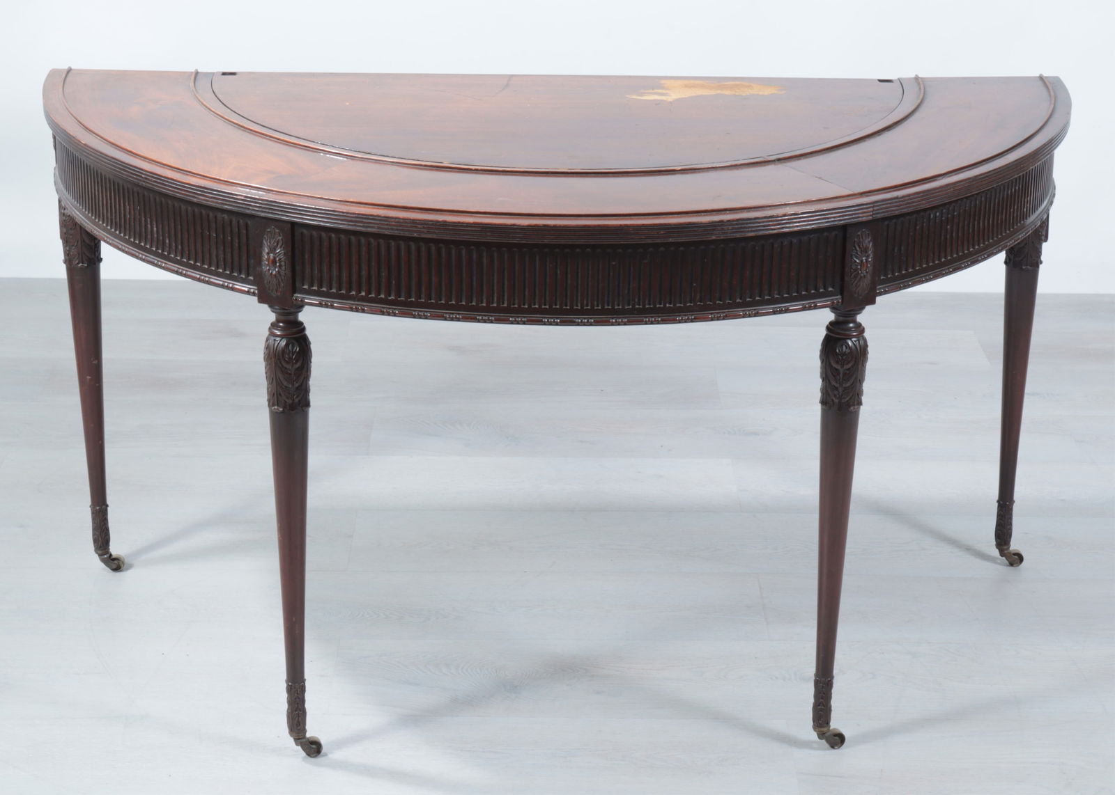 Edwardian Mahogany Demilune Drinks Table: Edwardian Mahogany Demilune Drinks Table, Early 20th C.Dimensions: 29.75" H x 56.5" W x 29.5" D