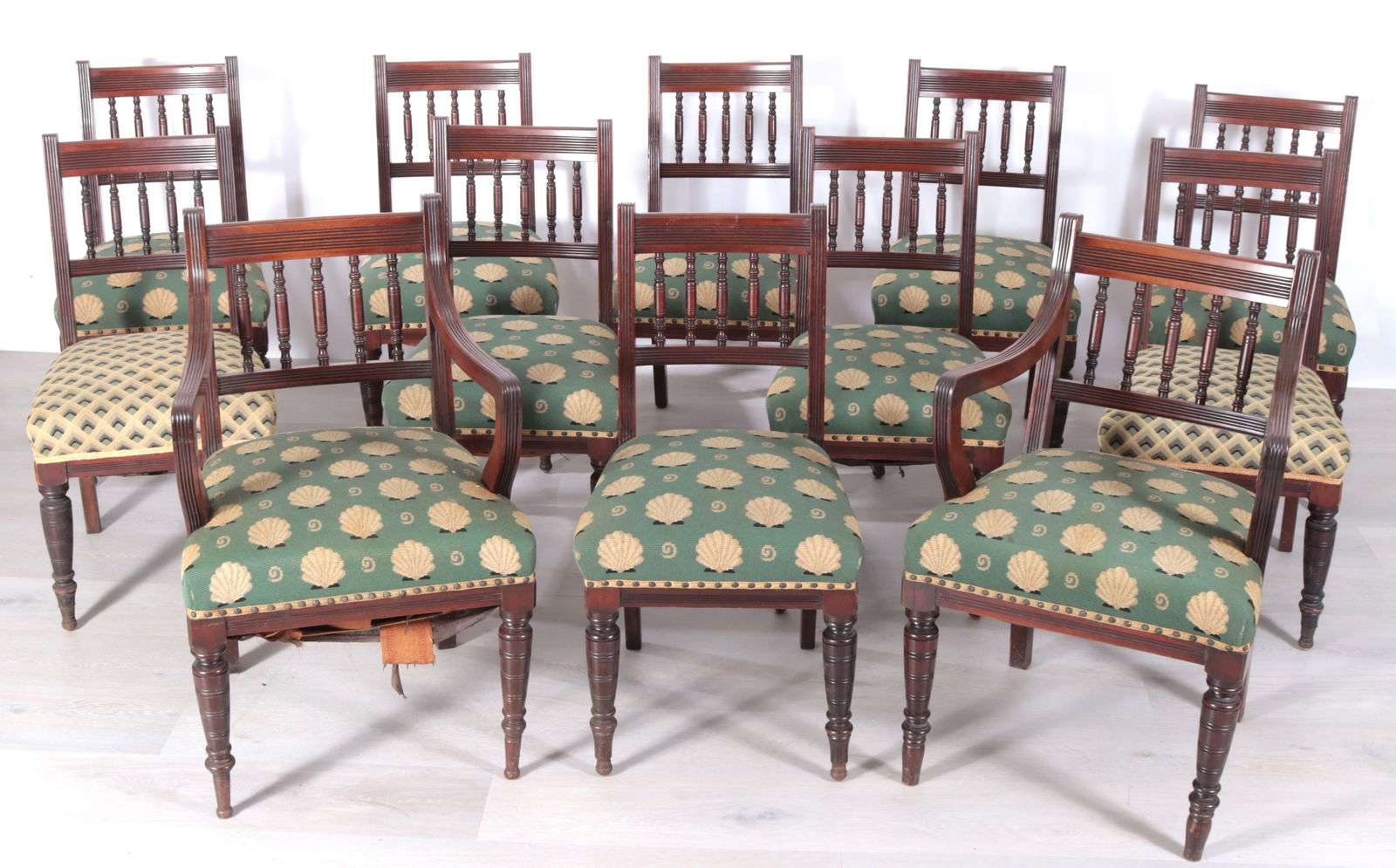 12 Aesthetic Movement Mahogany Dining Chairs: 12 Aesthetic Movement Mahogany Dining Chairs, including two armchairs. 10 upholstered in green shell needlepoint and two upholstered in geometric needlepoint.Dimensions: 35.5" H x 18" W x 23" D