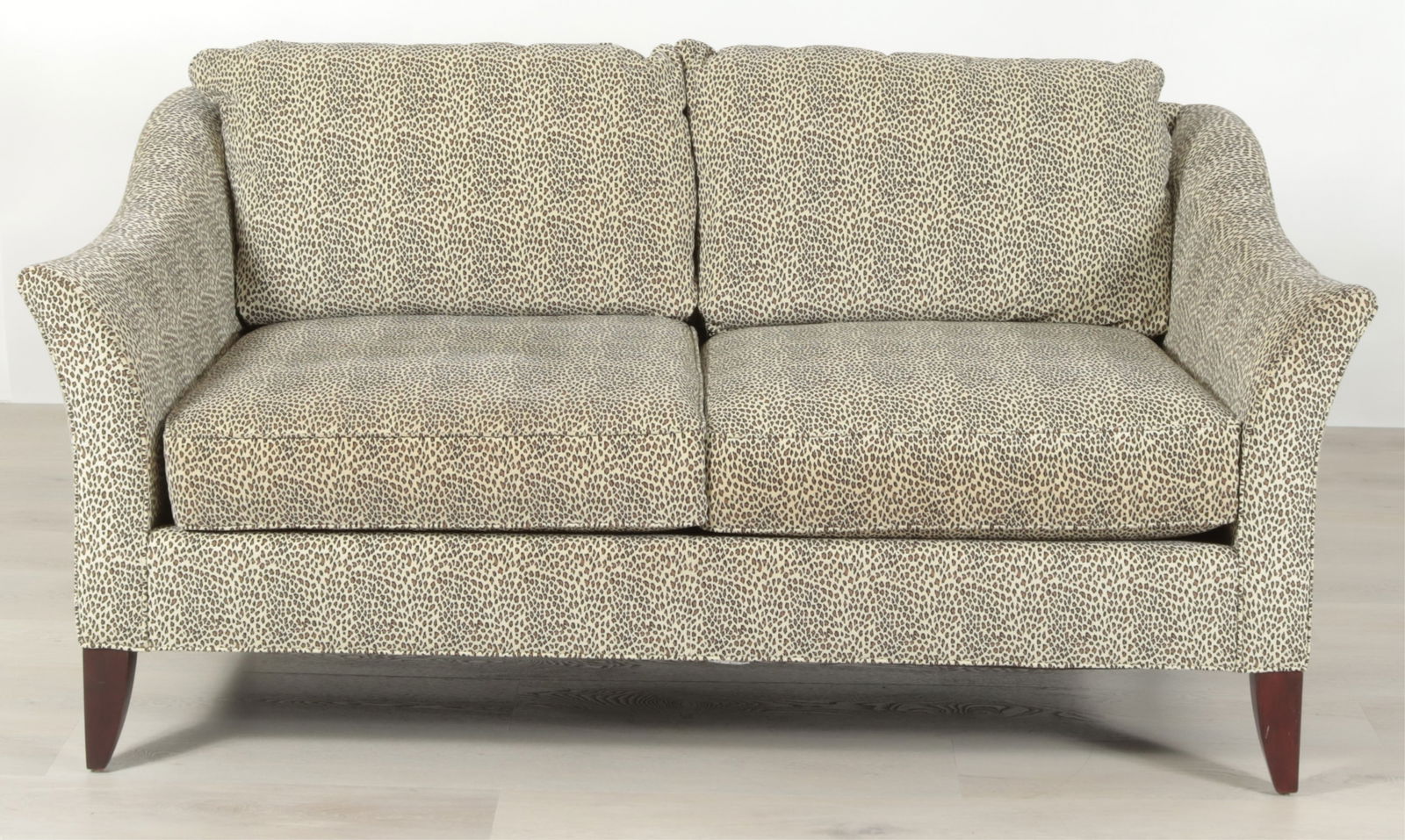 Stickley Leopard Suede Upholstered Sofa: Stickley Leopard-print suede upholstered sofa, with 4 throw pillows.Dimensions: 32" H x 65" L x 36" DProperty from the Estate of Mary C. Bailey