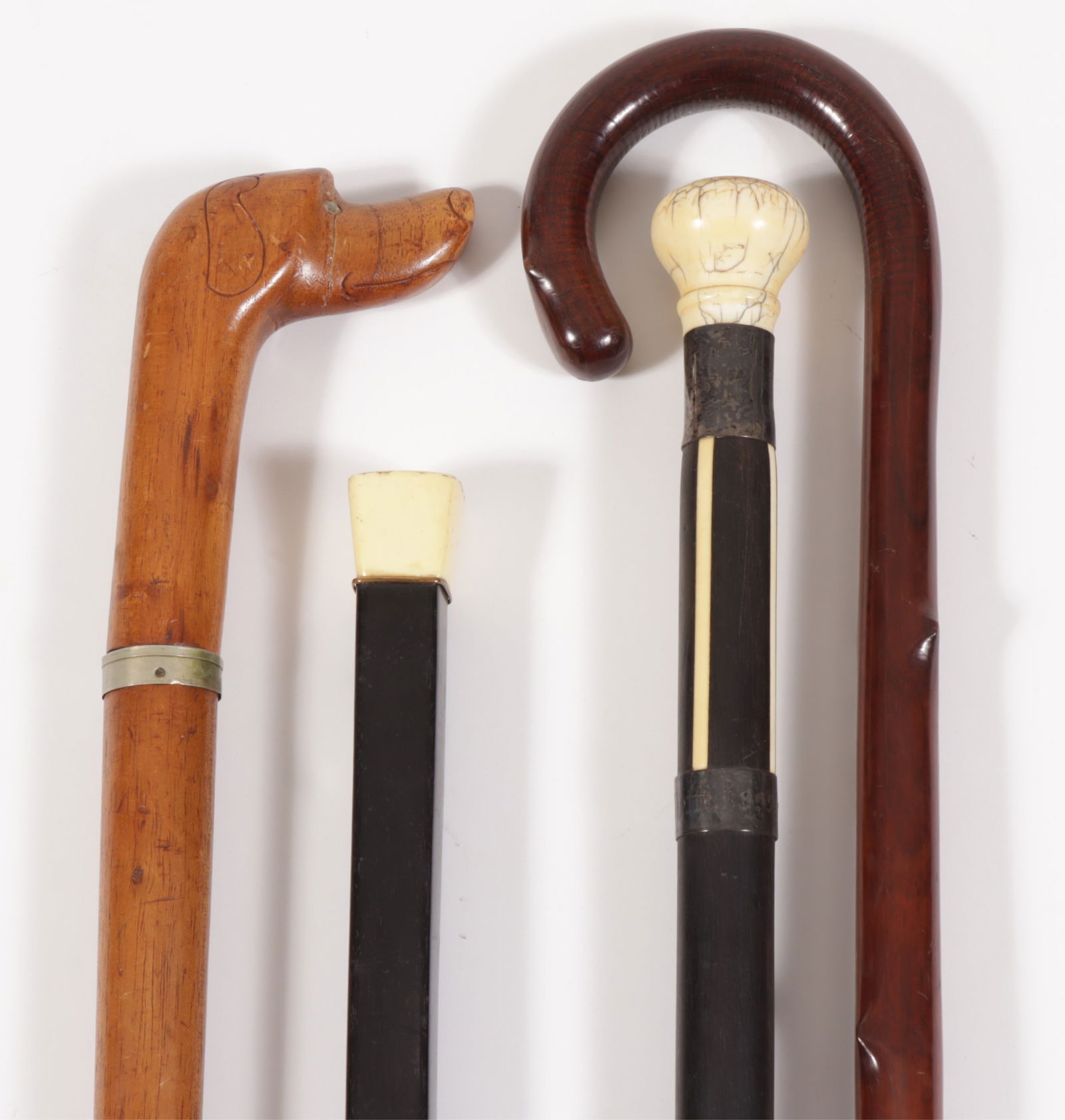 Inlaid Ebonized & Naturalistic Walking Canes: Four Inlaid Ebonized & Naturalistic Walking Canes Dimensions: Largest 27.5" H
